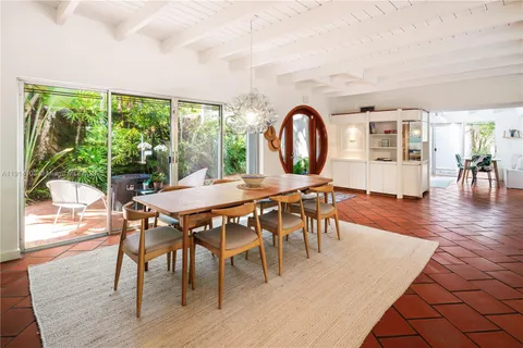 a dining room with furniture window wooden floor
