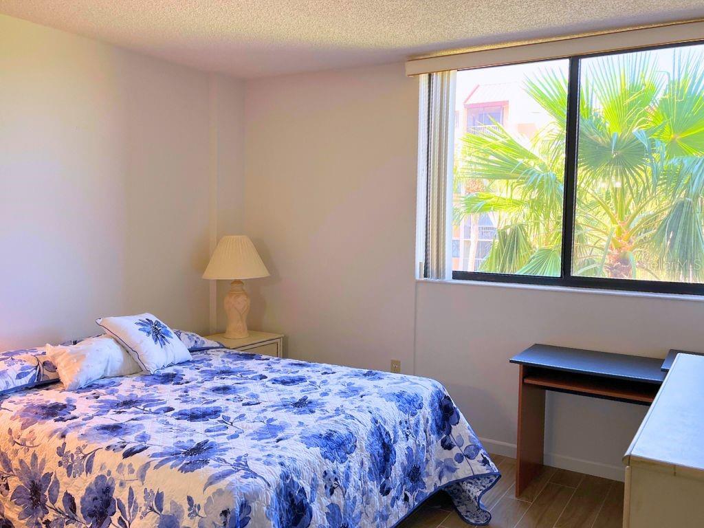 3006 Caring Way, Unit 329 Port Charlotte, FL 33952 - Photo 11 of 37 a bedroom with a bed and a window