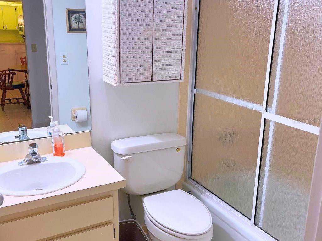 3006 Caring Way, Unit 329 Port Charlotte, FL 33952 - Photo 13 of 37 a white toilet sitting next to a bathroom sink