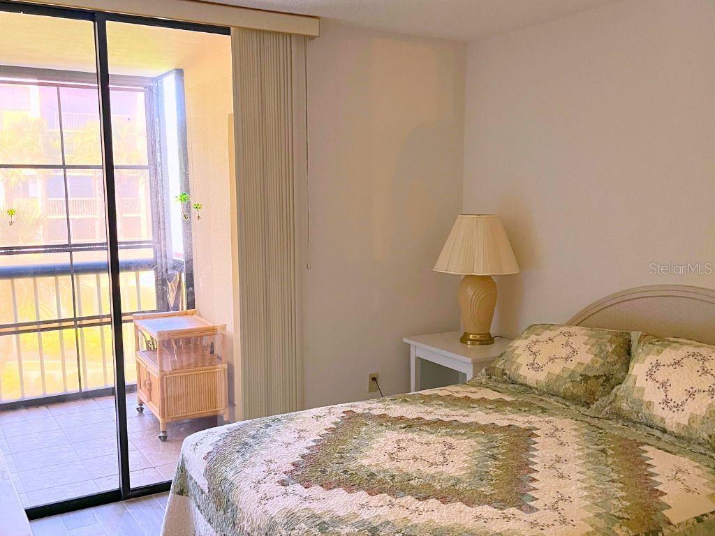 3006 Caring Way, Unit 329 Port Charlotte, FL 33952 - Photo 14 of 37 a bedroom with a bed and a window