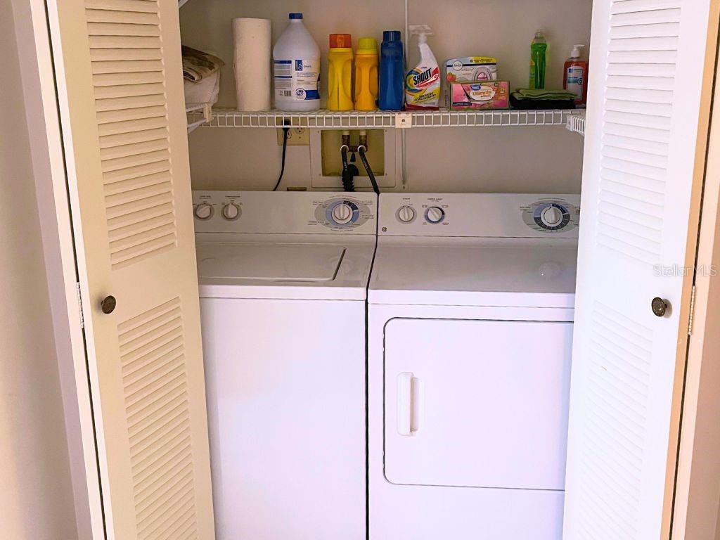 3006 Caring Way, Unit 329 Port Charlotte, FL 33952 - Photo 17 of 37 a utility room with dryer and washer