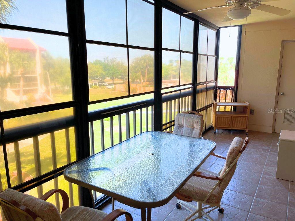3006 Caring Way, Unit 329 Port Charlotte, FL 33952 - Photo 18 of 37 a view of a chairs and table in the balcony