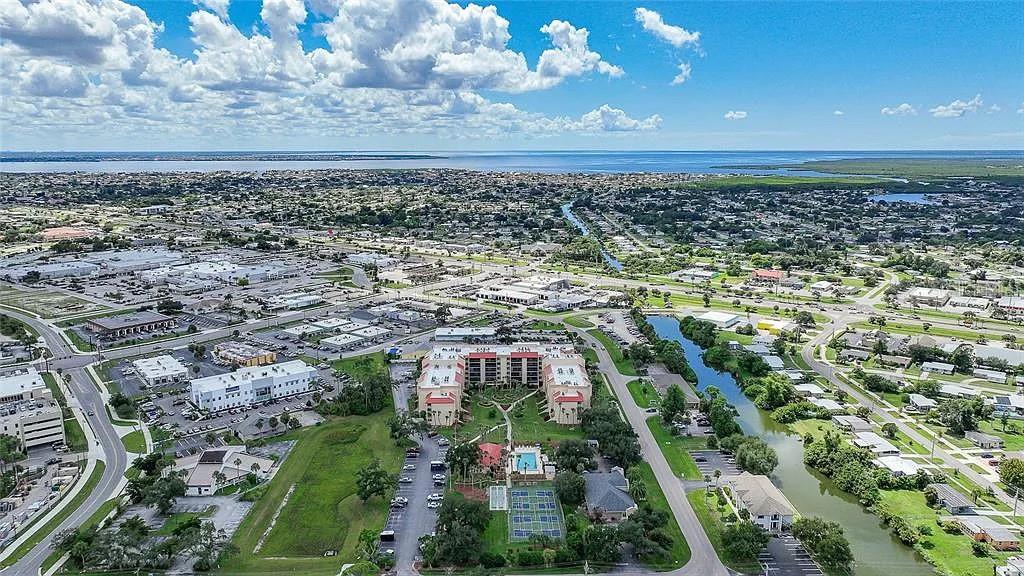 3006 Caring Way, Unit 329 Port Charlotte, FL 33952 - Photo 23 of 37 a view of a city with lots of trees
