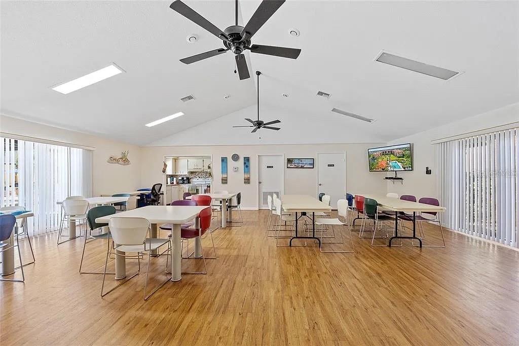 3006 Caring Way, Unit 329 Port Charlotte, FL 33952 - Photo 32 of 37 a living room with furniture and wooden floor