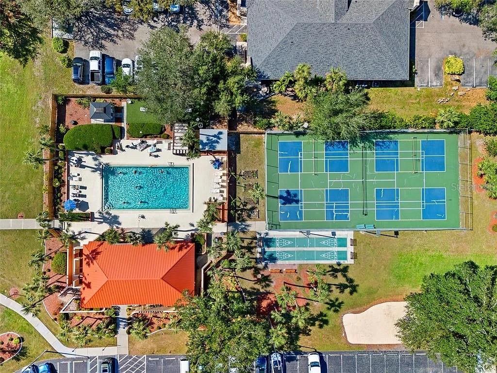 3006 Caring Way, Unit 329 Port Charlotte, FL 33952 - Photo 35 of 37 an aerial view of a house with a yard and potted plants