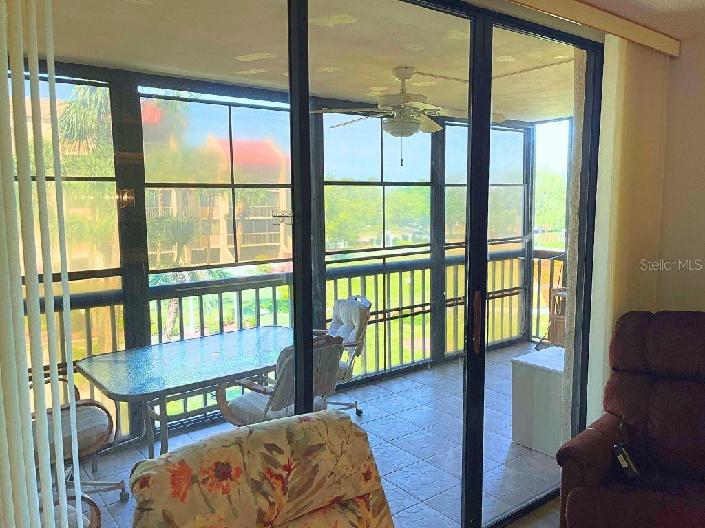 3006 Caring Way, Unit 329 Port Charlotte, FL 33952 - Photo 6 of 37 a living room with furniture and a window
