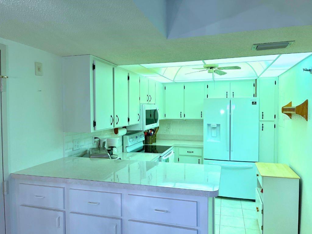 3006 Caring Way, Unit 329 Port Charlotte, FL 33952 - Photo 7 of 37 a bathroom with a sink and mirror