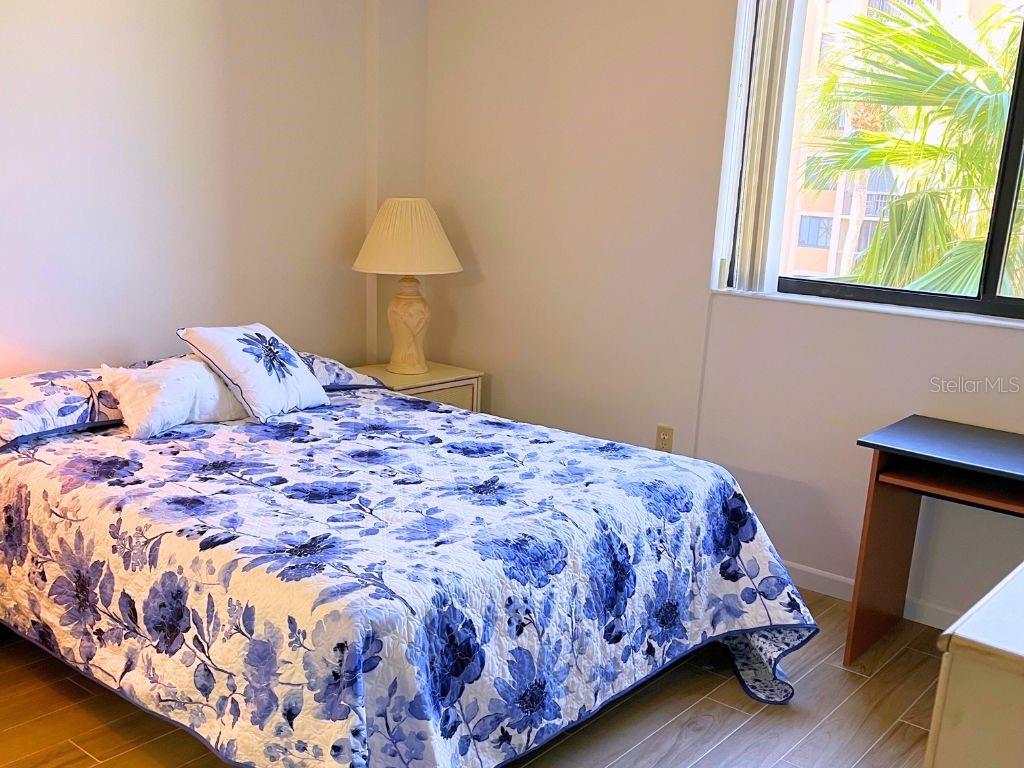 3006 Caring Way, Unit 329 Port Charlotte, FL 33952 - Photo 10 of 37 a bedroom with a bed and a window