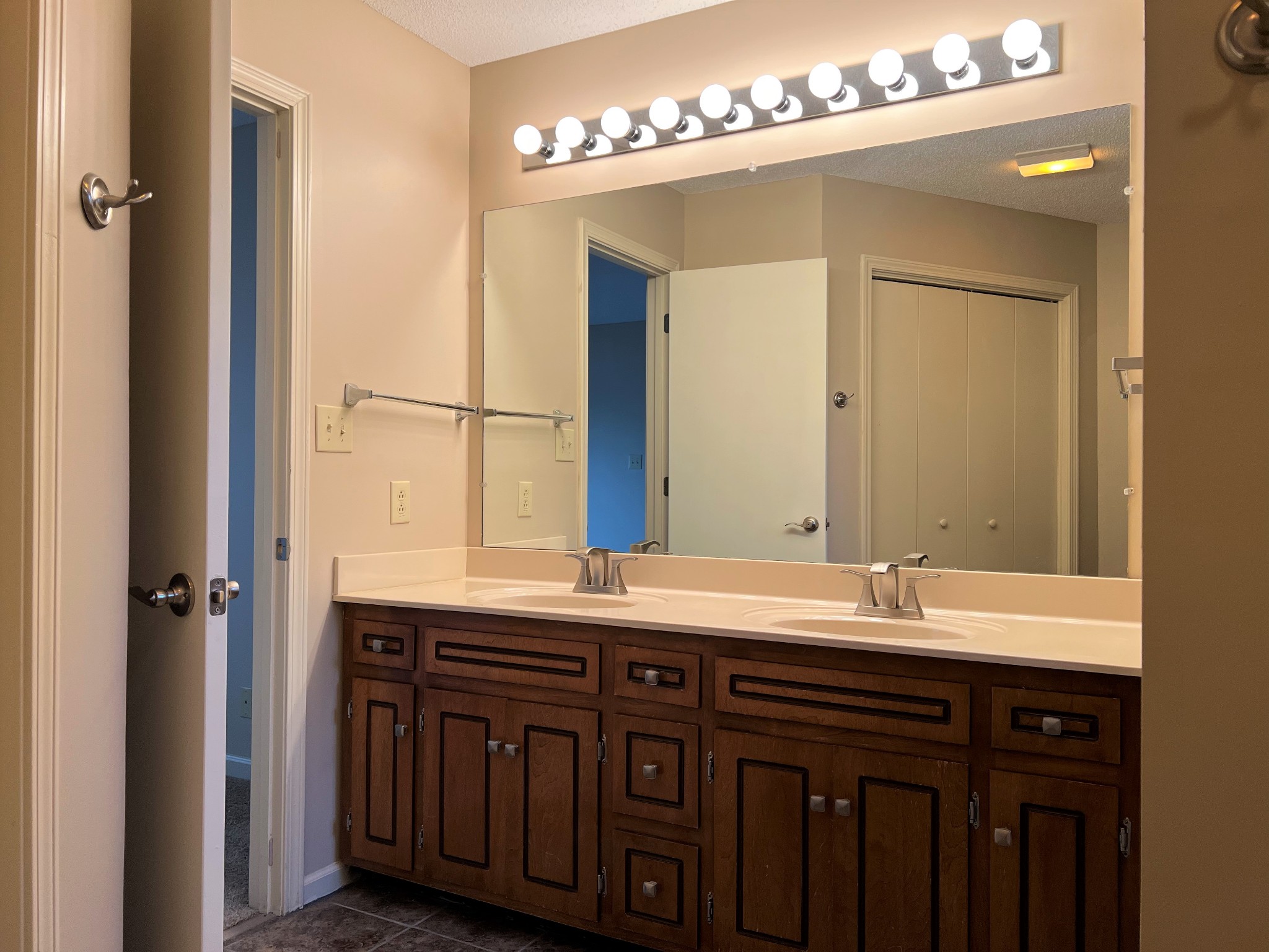 153 Old Farmers Road Clarksville, TN 37043 - Photo 13 of 23 a bathroom with a double vanity sink and a mirror