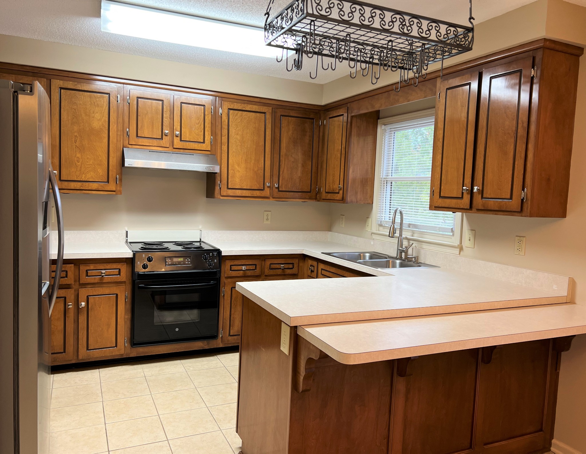 153 Old Farmers Road Clarksville, TN 37043 - Photo 7 of 23 a kitchen that has a sink and a stove