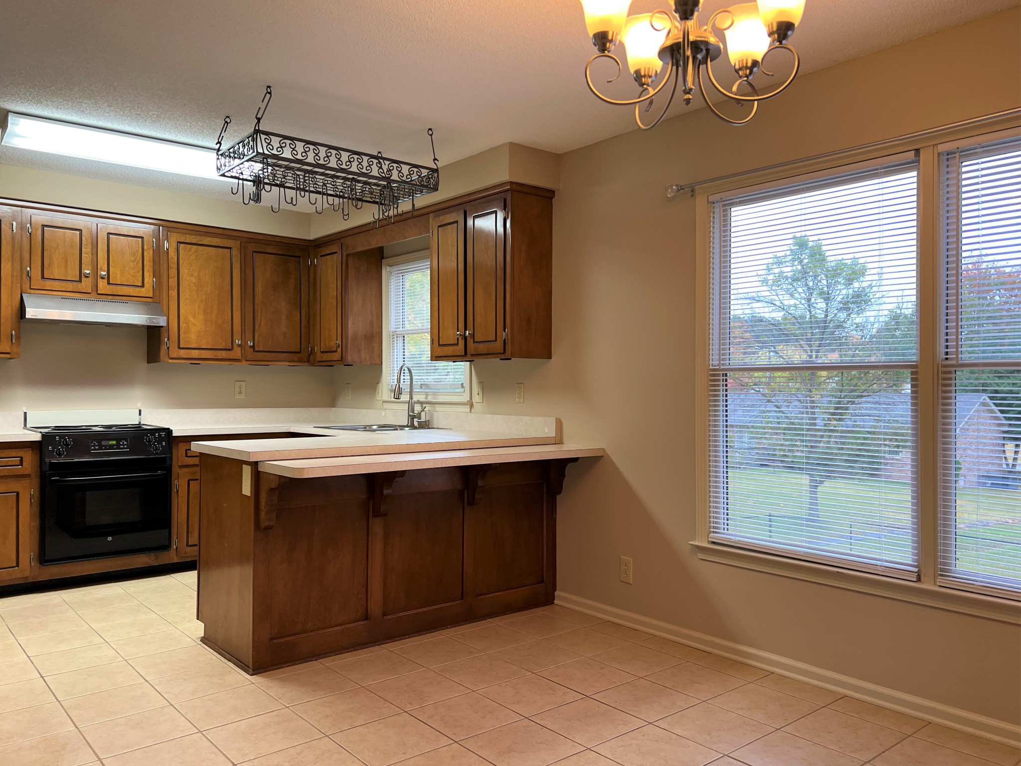 153 Old Farmers Road Clarksville, TN 37043 - Photo 8 of 23 a kitchen with a stove sink and cabinets