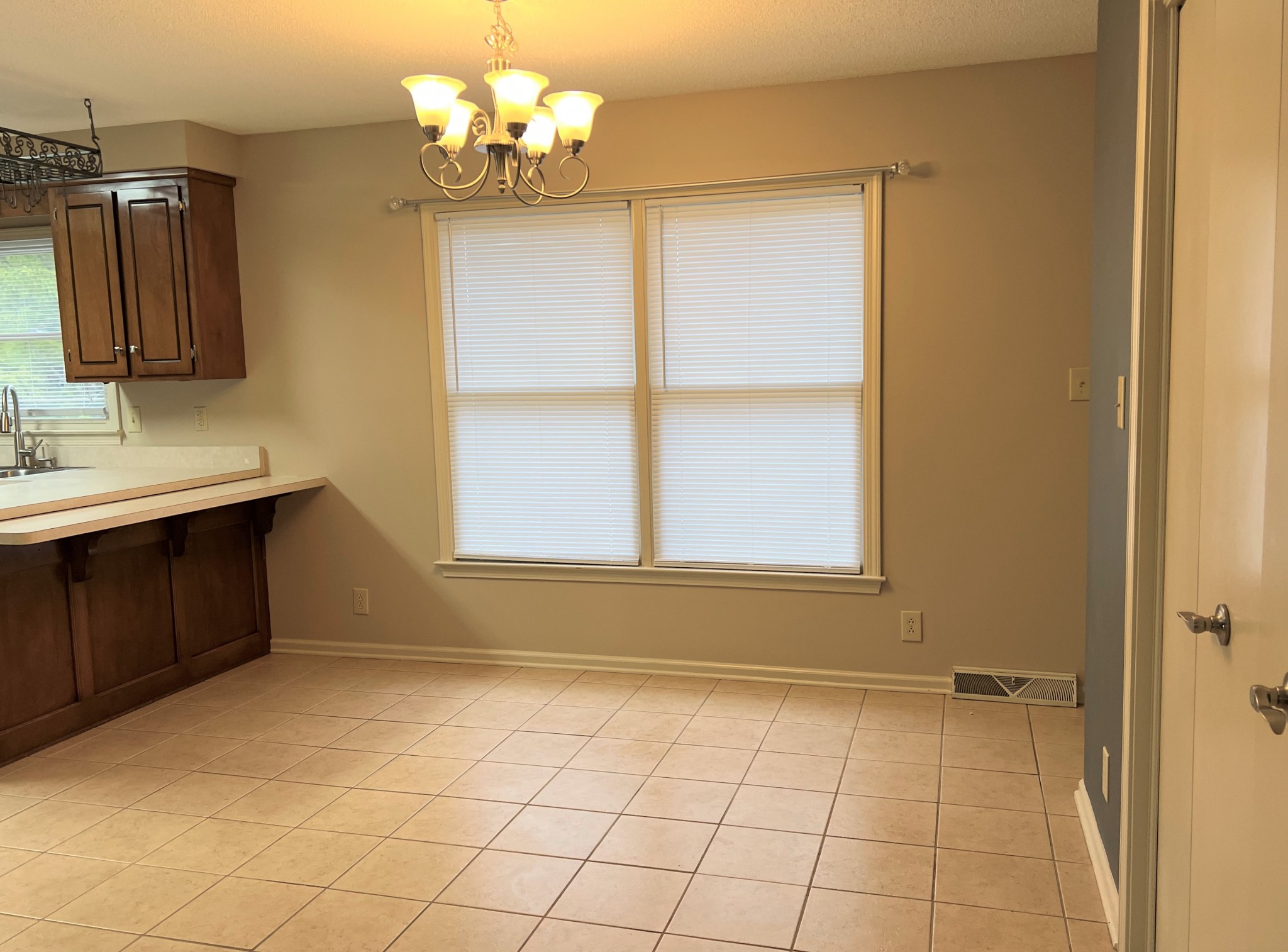 153 Old Farmers Road Clarksville, TN 37043 - Photo 9 of 23 a view of a kitchen with a dishwasher cabinets and a window