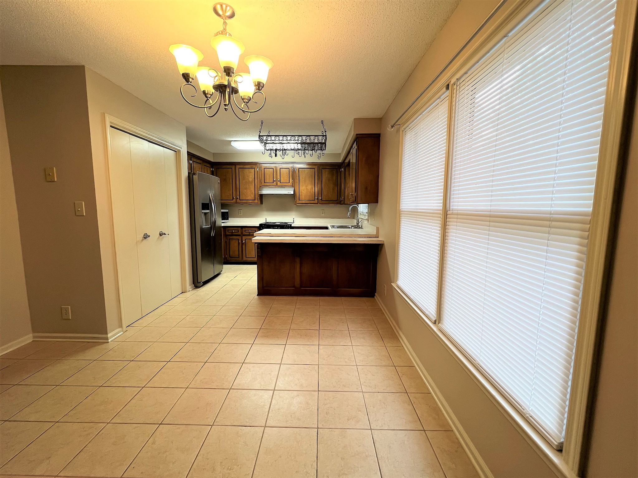 153 Old Farmers Road Clarksville, TN 37043 - Photo 10 of 23 a large kitchen with stainless steel appliances granite countertop a sink and cabinets