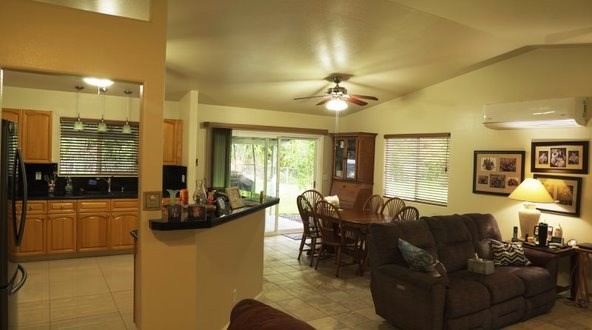 14-521 Hapuu Road Pahoa, HI 96778 - Photo 3 of 13 a living room with furniture and a flat screen tv