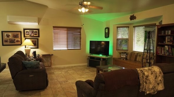 14-521 Hapuu Road Pahoa, HI 96778 - Photo 4 of 13 a living room with furniture and a flat screen tv