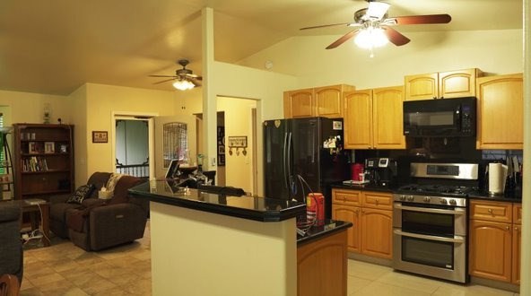 14-521 Hapuu Road Pahoa, HI 96778 - Photo 5 of 13 a kitchen with a refrigerator and a sink