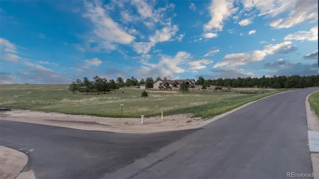 a view of a lake with green space