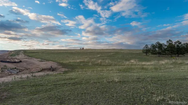 a view of a lake with a big yard