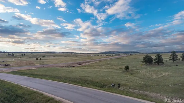a view of a terrace with yard