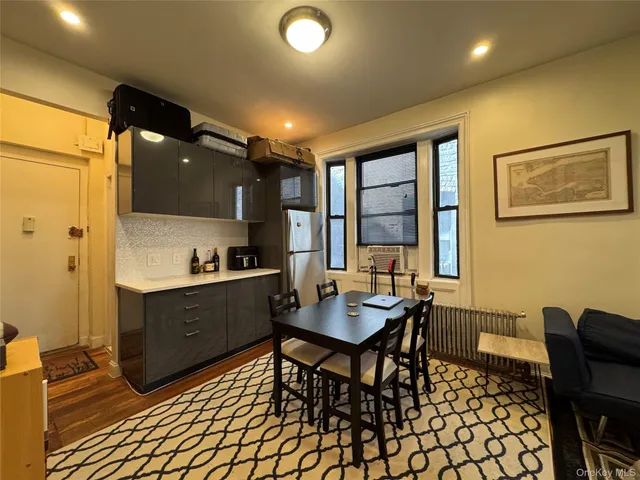 a kitchen with a table and chairs in it