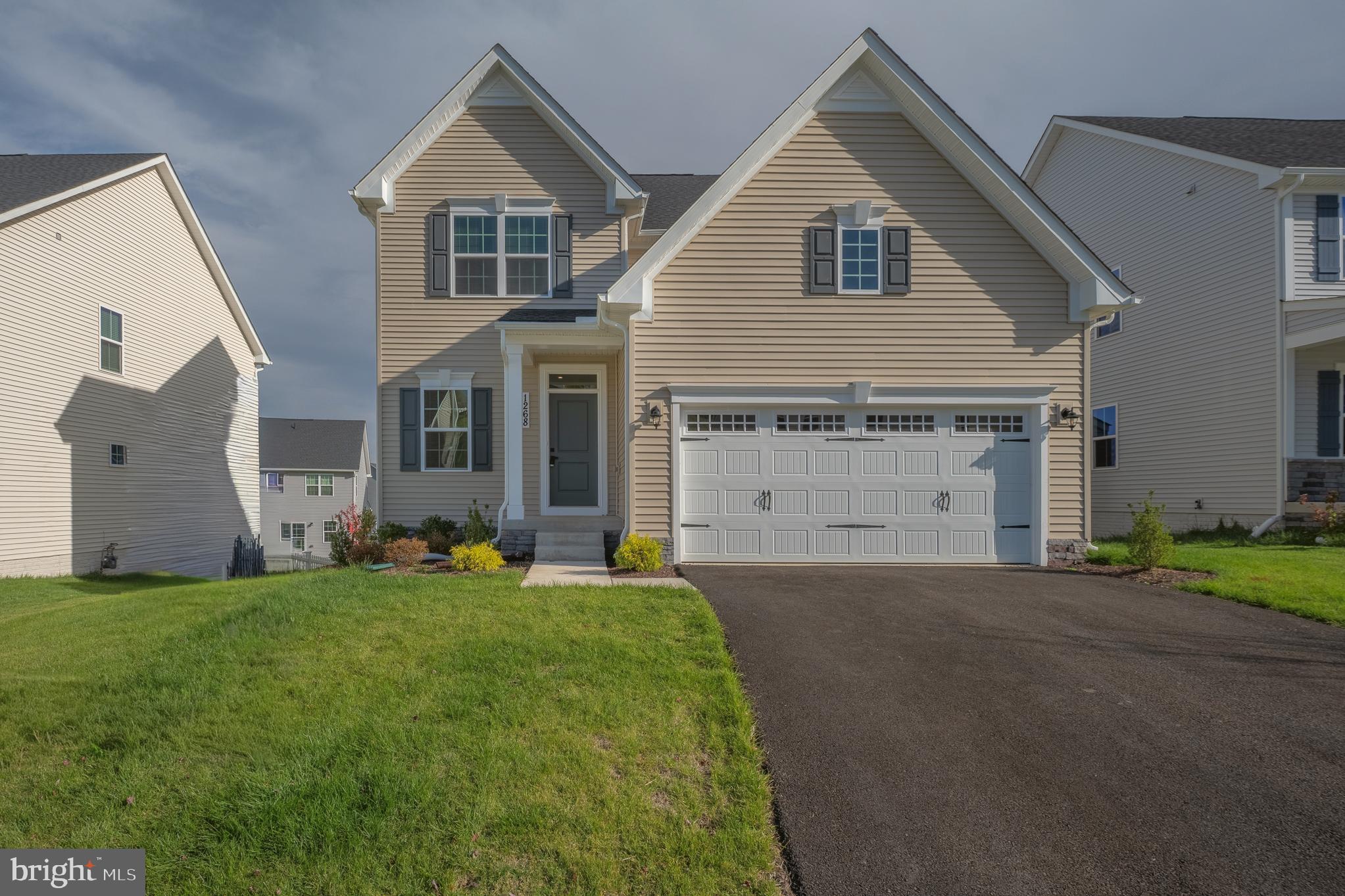 1268 Backbone Way Frederick, MD 21702 - Photo 1 of 92 a front view of a house with a yard and garage