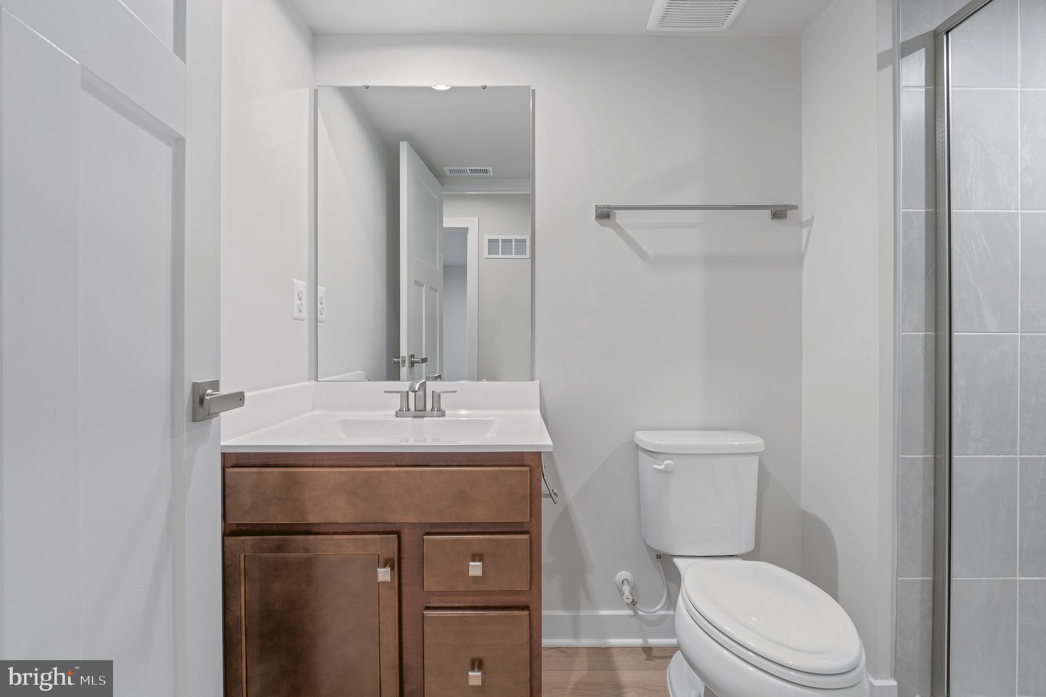 1268 Backbone Way Frederick, MD 21702 - Photo 80 of 92 a bathroom with a toilet a sink and a mirror