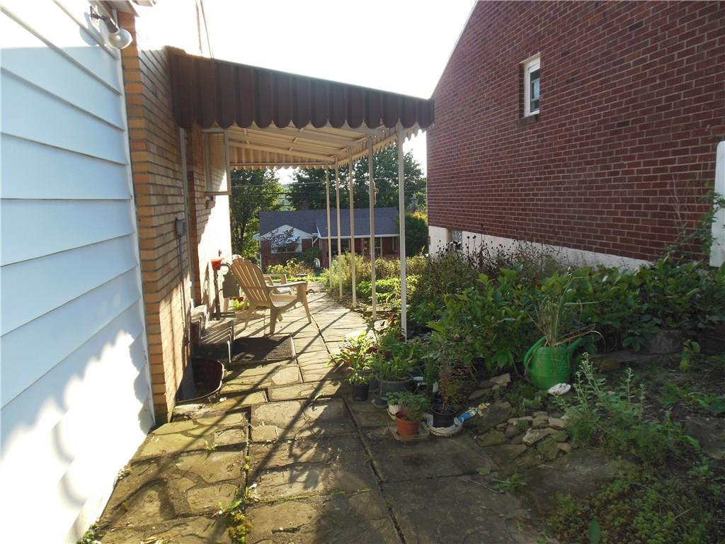 3759 Willett Road Baldwin, PA 15227 - Photo 20 of 25 Covered Awning over this Side Patio Area with Lovely Garden Spot To Enjoy Your Summer Evenings!
