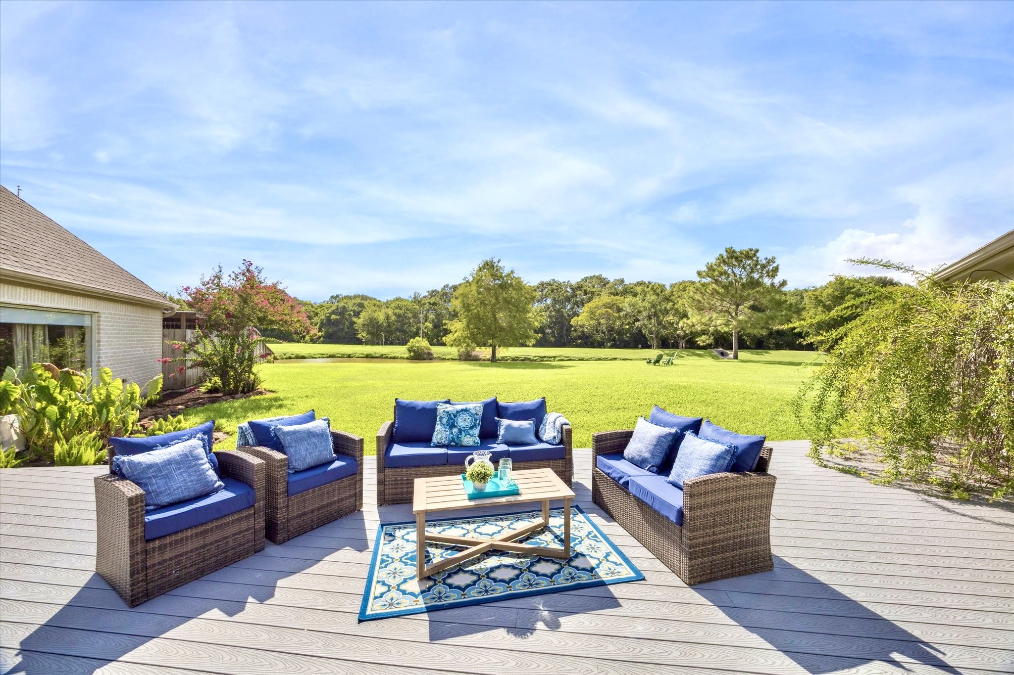 2904 Bridle Path Lane Friendswood, TX 77546 - Photo 43 of 49 The back of the home features multiple sitting areas and endless possibilities—ready for you to design your ideal outdoor retreat, whether for relaxing, entertaining, or soaking in the peaceful views.