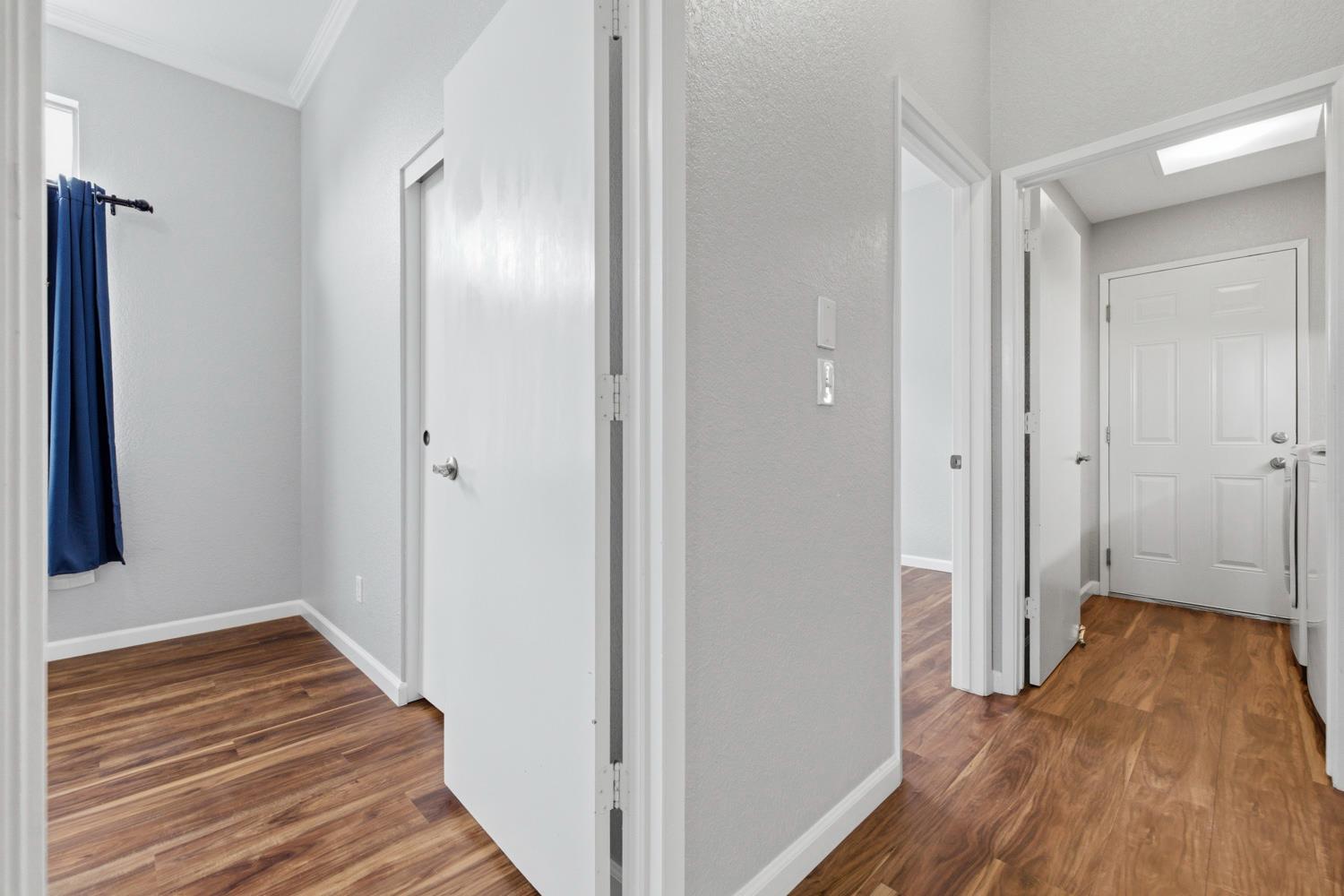 969 Colson Way Galt, CA 95632 - Photo 27 of 38 a view of a hallway with wooden floor and staircase