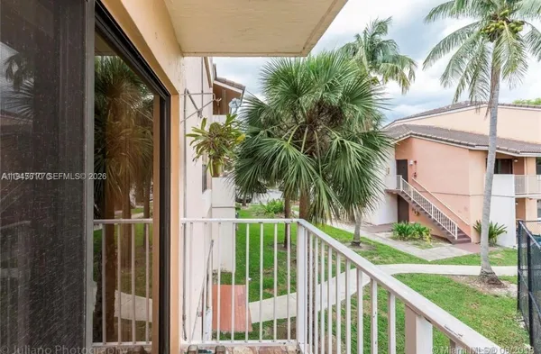 a view of balcony with small garden