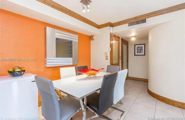 a view of a dining room with furniture and window