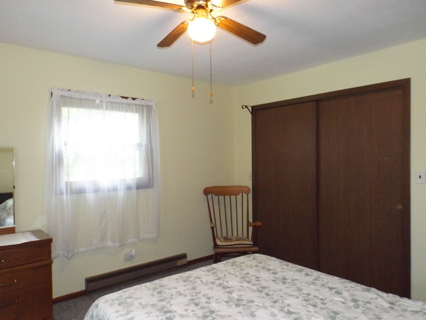 7573 Blue Goose Road Prophetstown, IL 61277 - Photo 13 of 24 a bedroom with a bed and a window