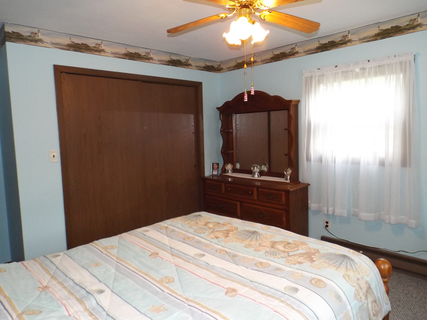 7573 Blue Goose Road Prophetstown, IL 61277 - Photo 15 of 24 a bedroom with a bed and a mirror