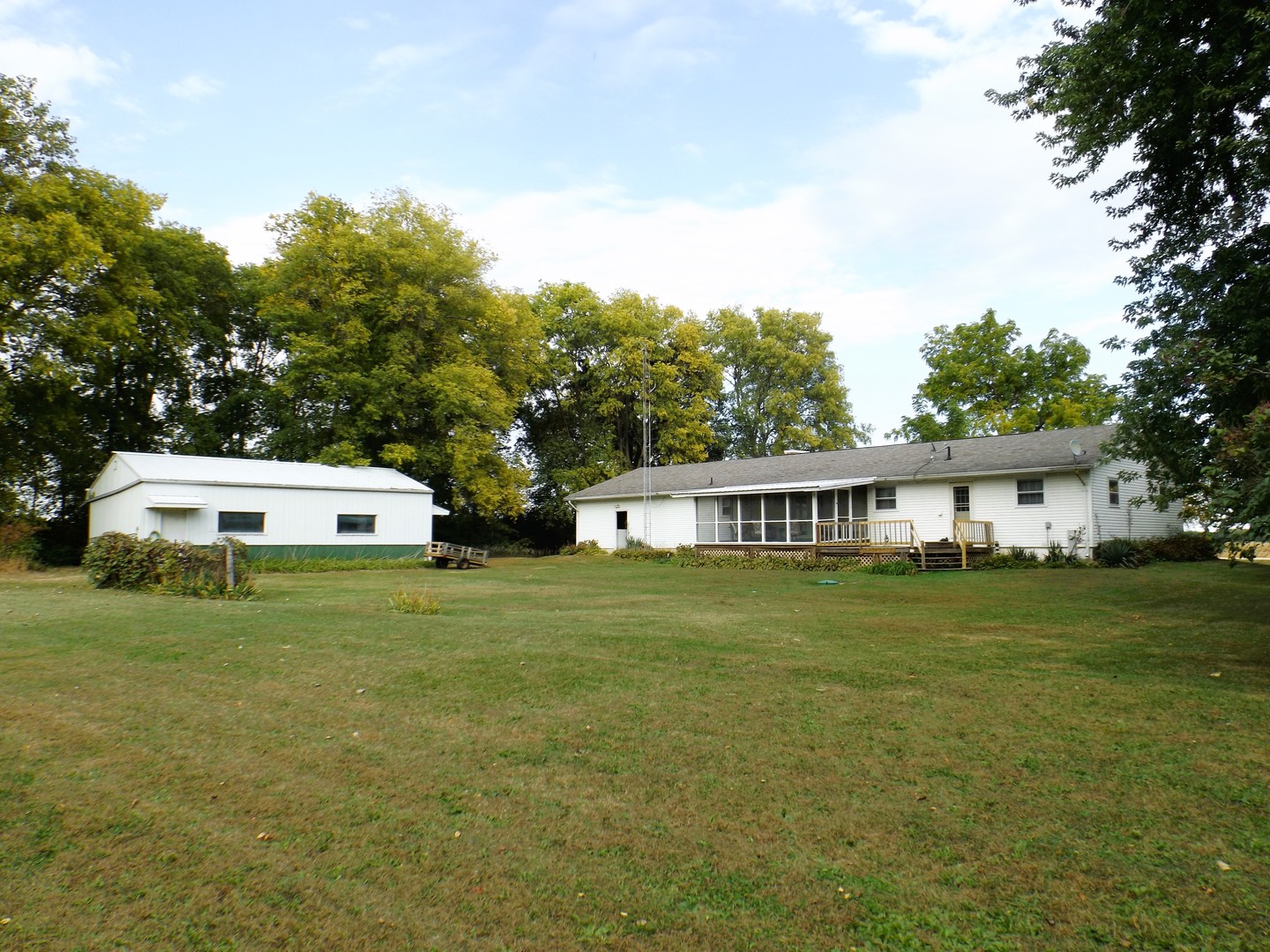 7573 Blue Goose Road Prophetstown, IL 61277 - Photo 2 of 24 a front view of a house with a garden