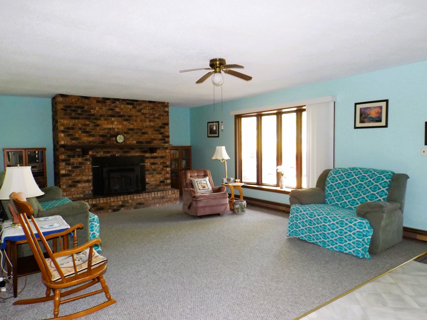 7573 Blue Goose Road Prophetstown, IL 61277 - Photo 6 of 24 a living room with furniture and a fireplace