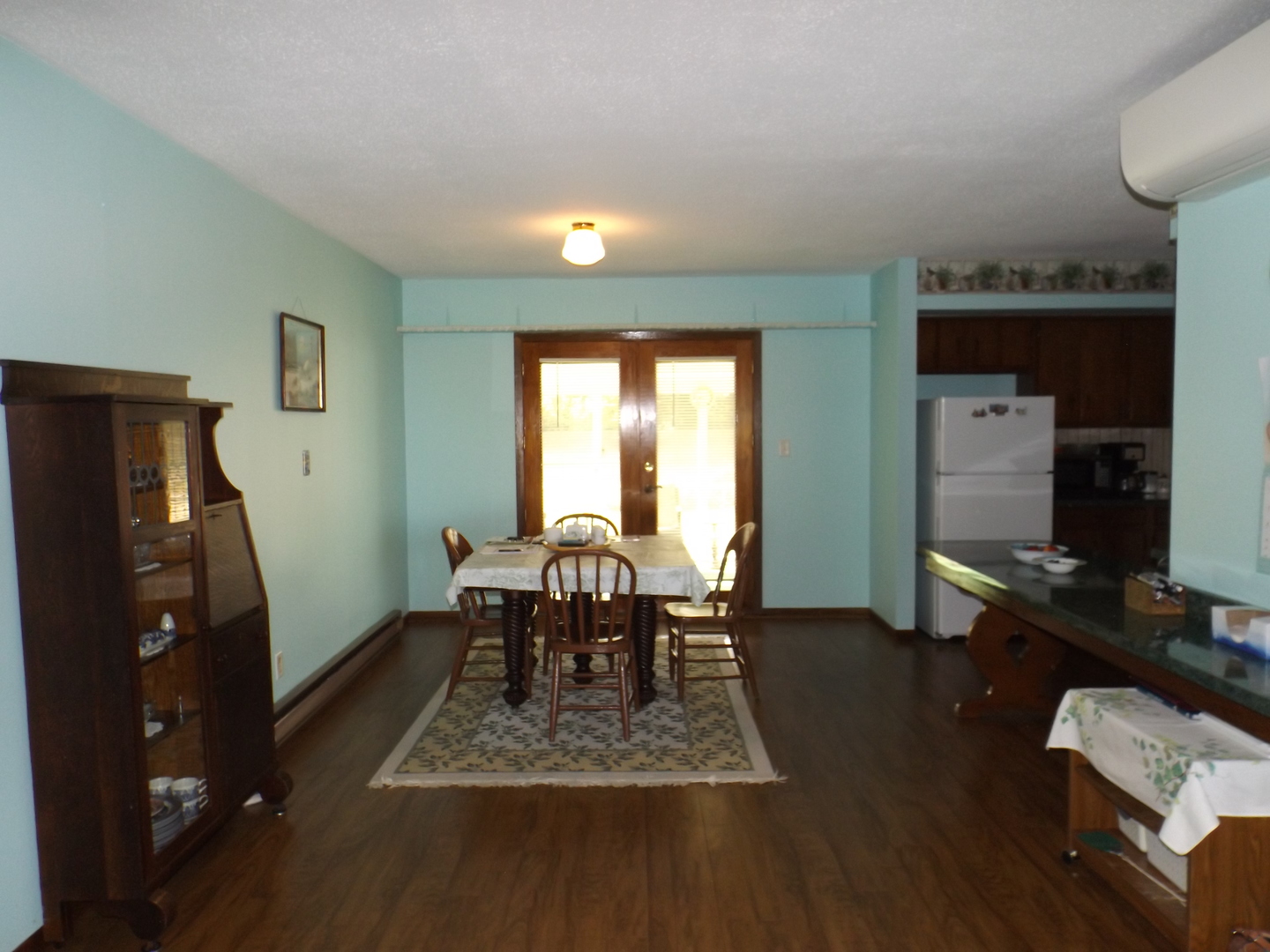 7573 Blue Goose Road Prophetstown, IL 61277 - Photo 8 of 24 a dining room with furniture and wooden floor