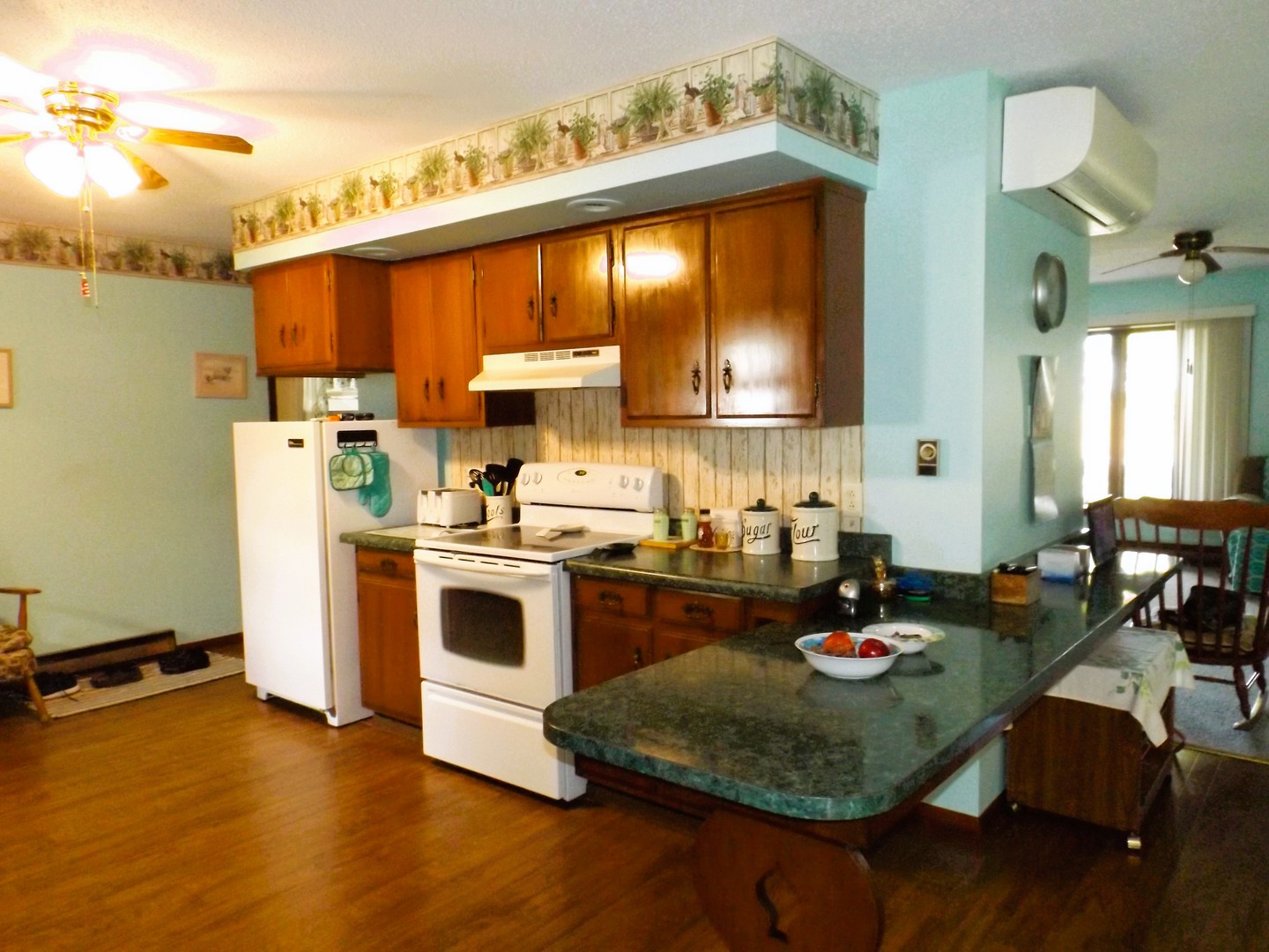 7573 Blue Goose Road Prophetstown, IL 61277 - Photo 10 of 24 a kitchen with a stove and a refrigerator