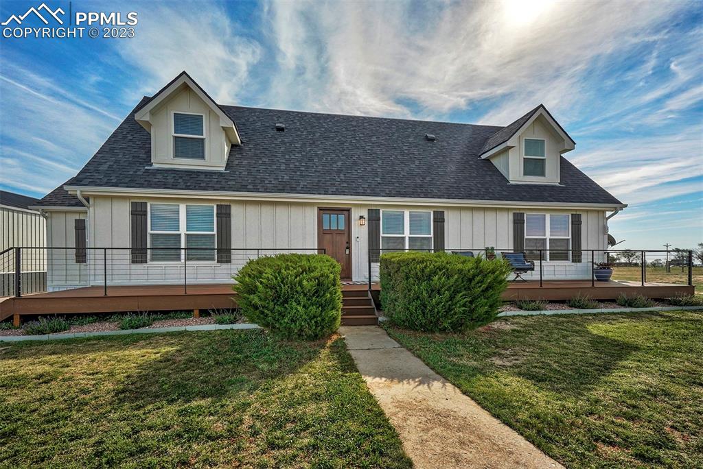 21750 Scott Road Calhan, CO 80808 - Photo 14 of 50 a front view of a house with a yard