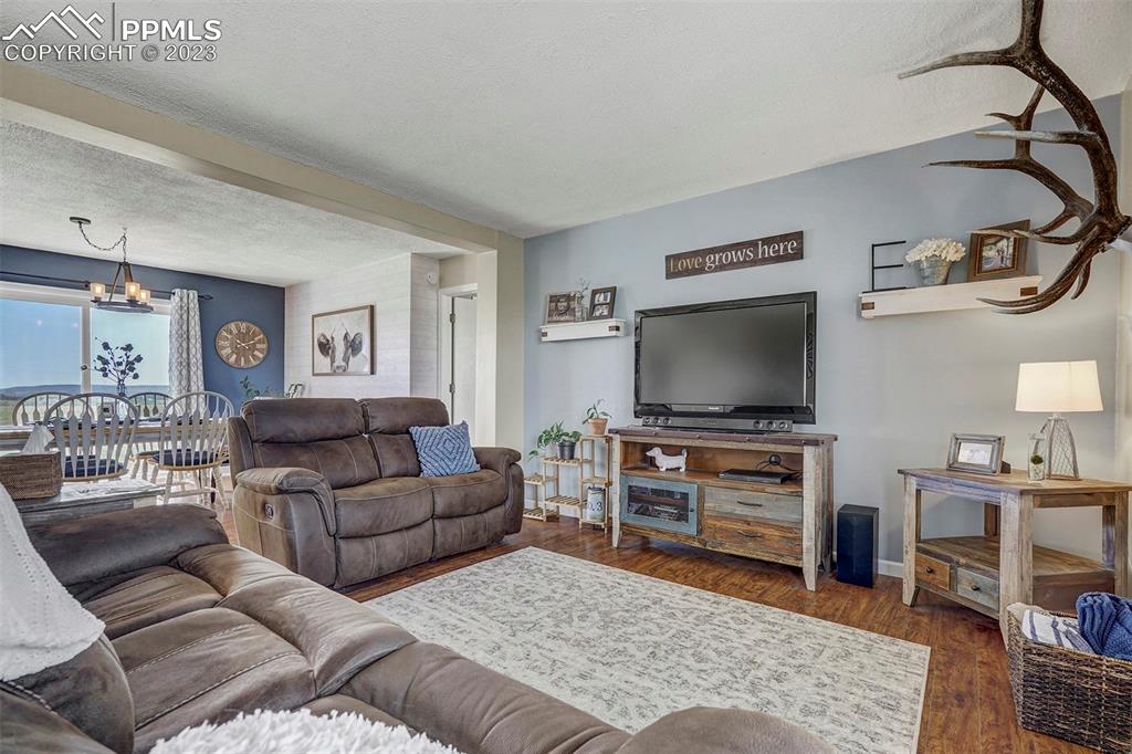 21750 Scott Road Calhan, CO 80808 - Photo 16 of 50 a living room with furniture and a flat screen tv