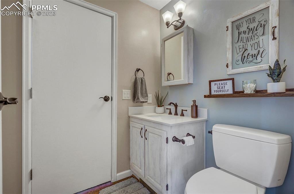 21750 Scott Road Calhan, CO 80808 - Photo 23 of 50 a white toilet sitting next to a bathroom sink
