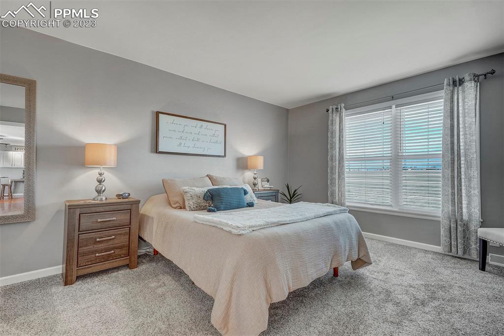 21750 Scott Road Calhan, CO 80808 - Photo 26 of 50 a bedroom with a bed dresser and a window