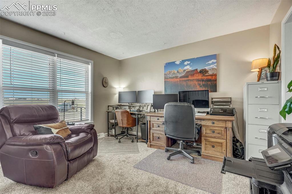 21750 Scott Road Calhan, CO 80808 - Photo 30 of 50 a living room with furniture and a window