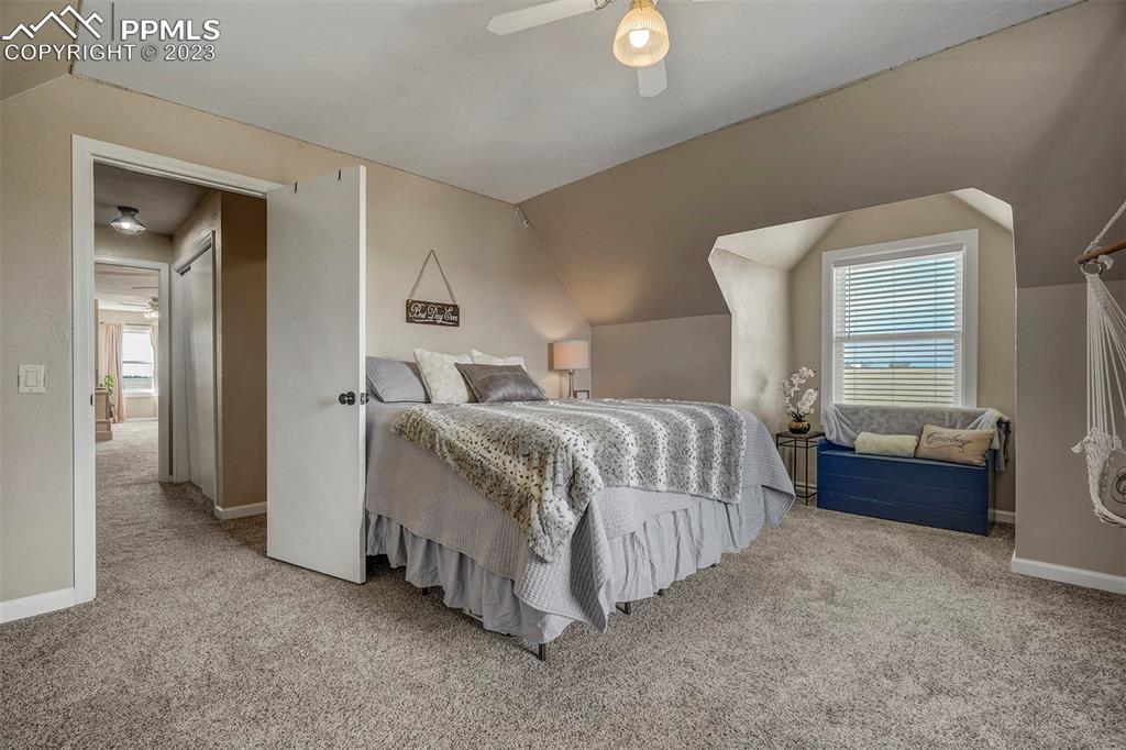 21750 Scott Road Calhan, CO 80808 - Photo 33 of 50 a bed room with a bed and a mirror