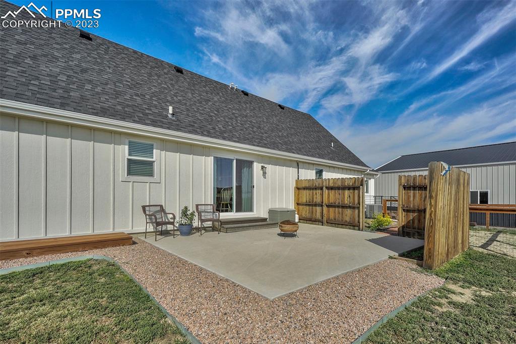 21750 Scott Road Calhan, CO 80808 - Photo 40 of 50 a bed room with a bed window and table
