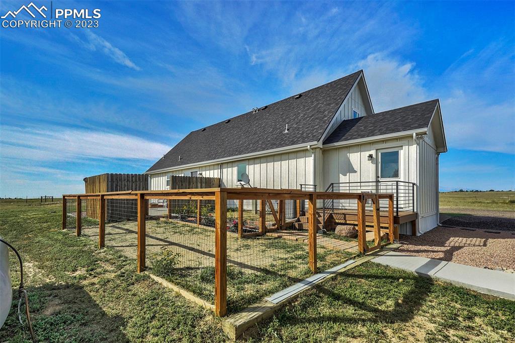 21750 Scott Road Calhan, CO 80808 - Photo 41 of 50 a balcony with table and chairs