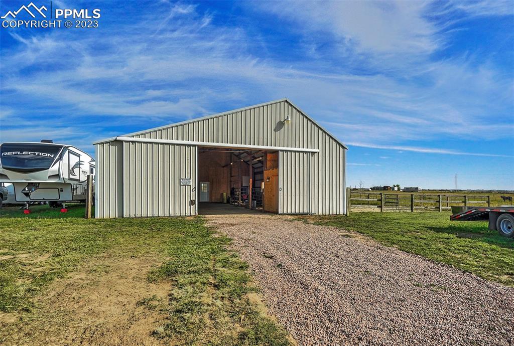 21750 Scott Road Calhan, CO 80808 - Photo 47 of 50 a view of a house with a yard