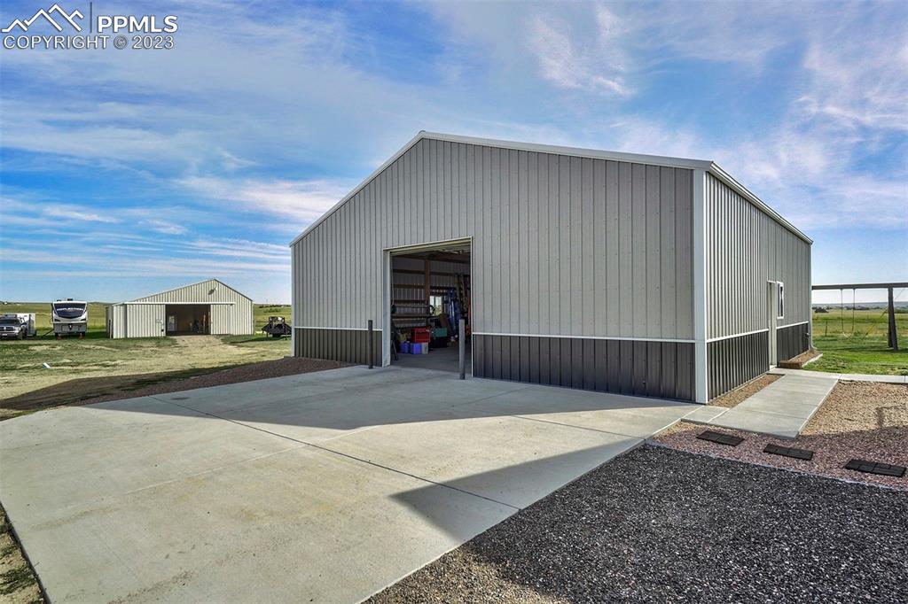 21750 Scott Road Calhan, CO 80808 - Photo 50 of 50 a view of a house with a backyard
