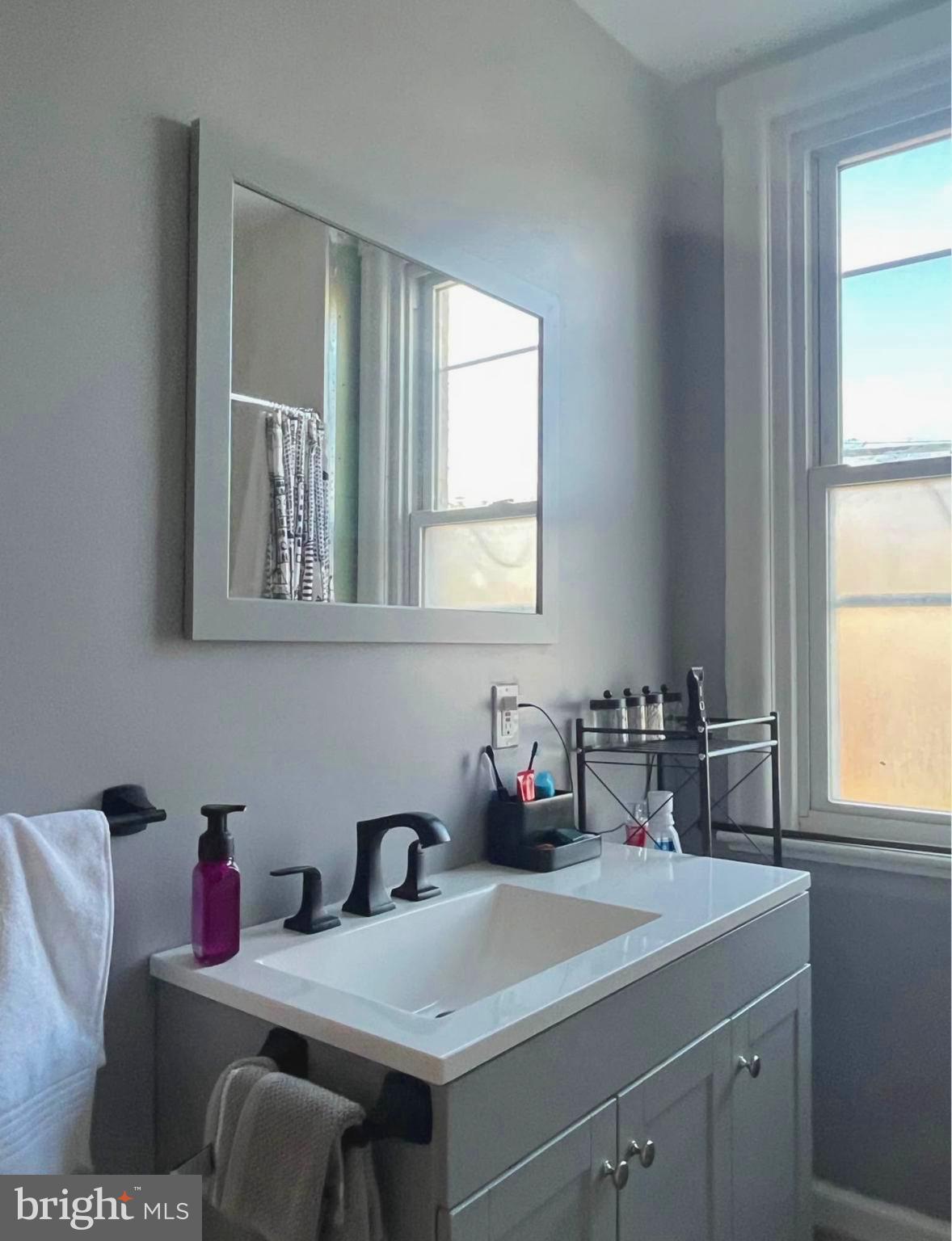 4084 Higbee Street Philadelphia, PA 19135 - Photo 11 of 12 a kitchen with a sink cabinets and a window