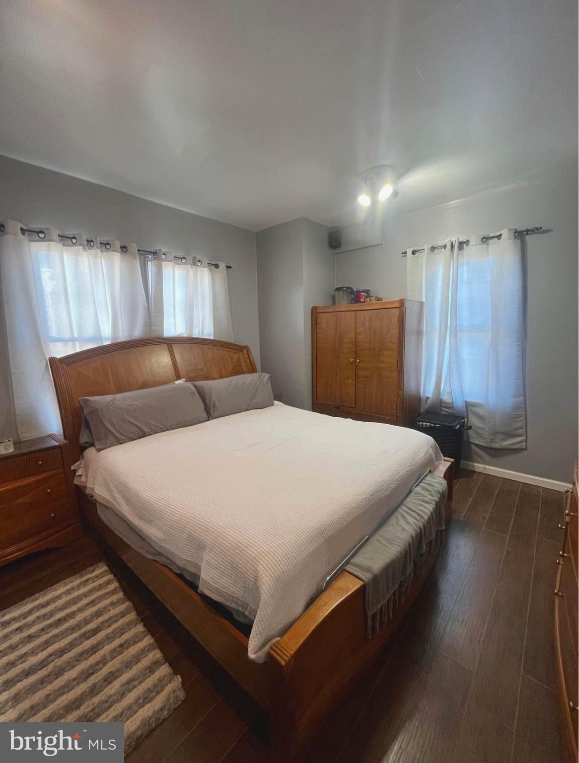 4084 Higbee Street Philadelphia, PA 19135 - Photo 5 of 12 a bedroom with a bed and window