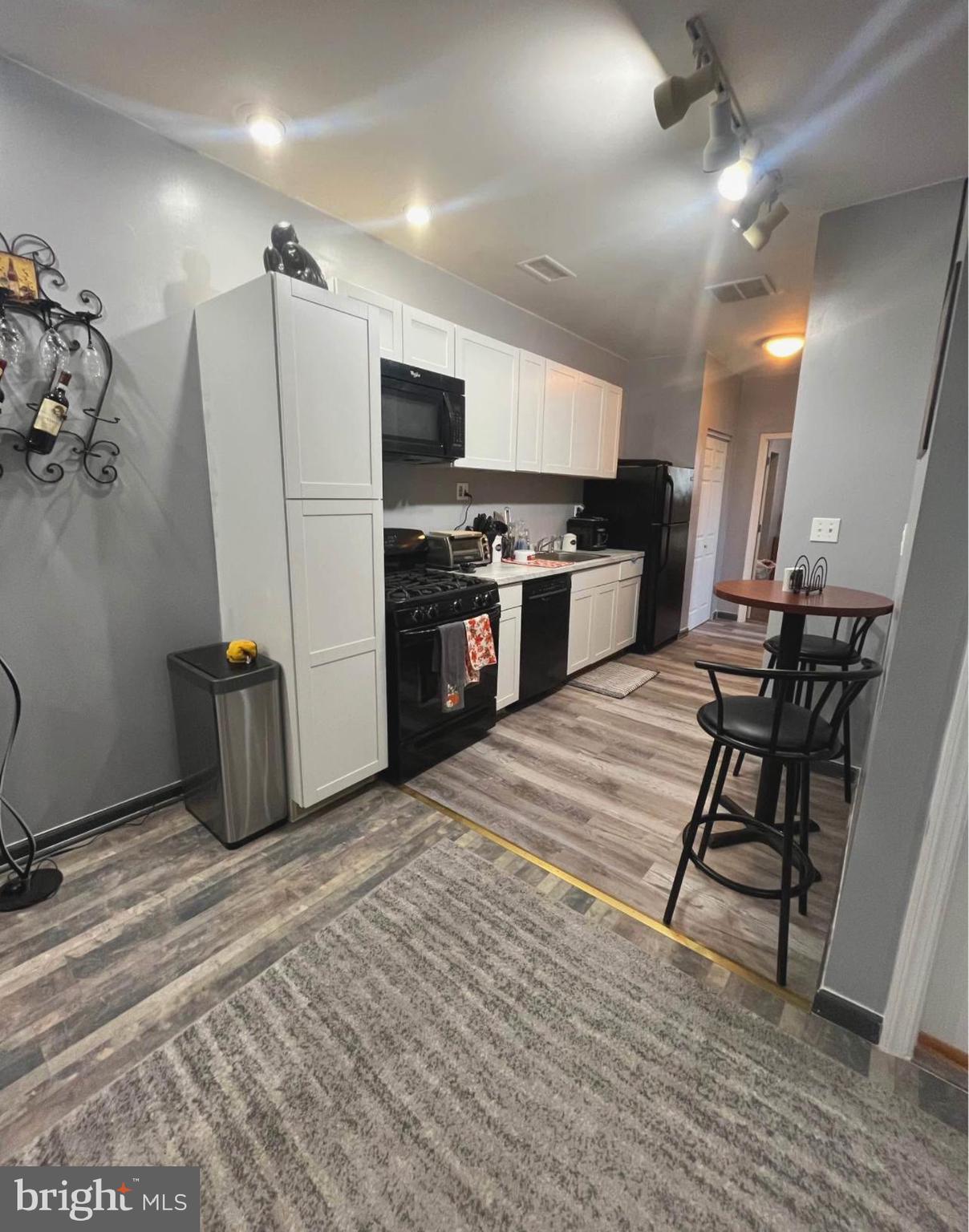 4084 Higbee Street Philadelphia, PA 19135 - Photo 8 of 12 a kitchen with stainless steel appliances granite countertop a refrigerator a stove and a sink